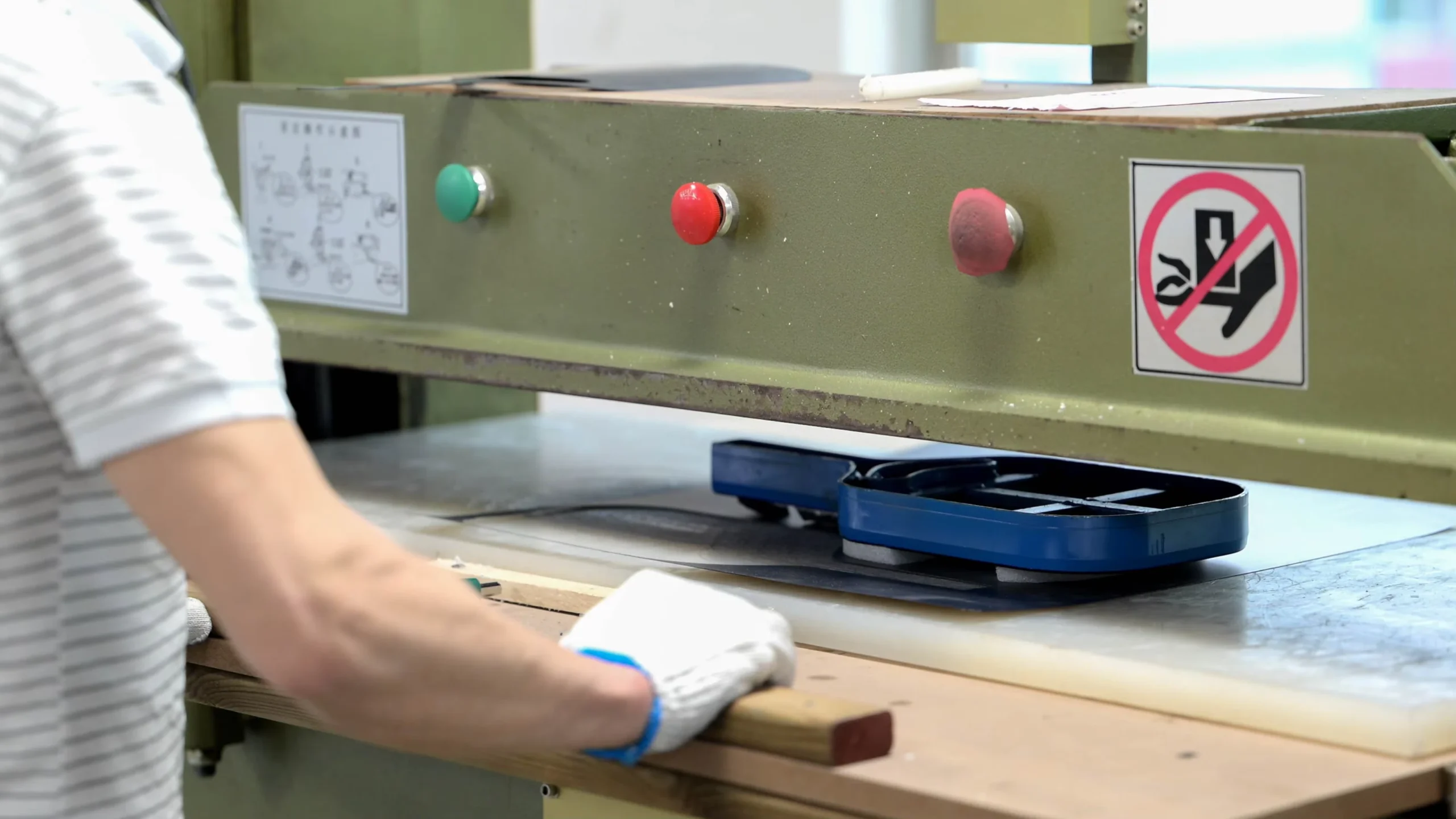 Die-cutting press used to cut paddle materials to shape